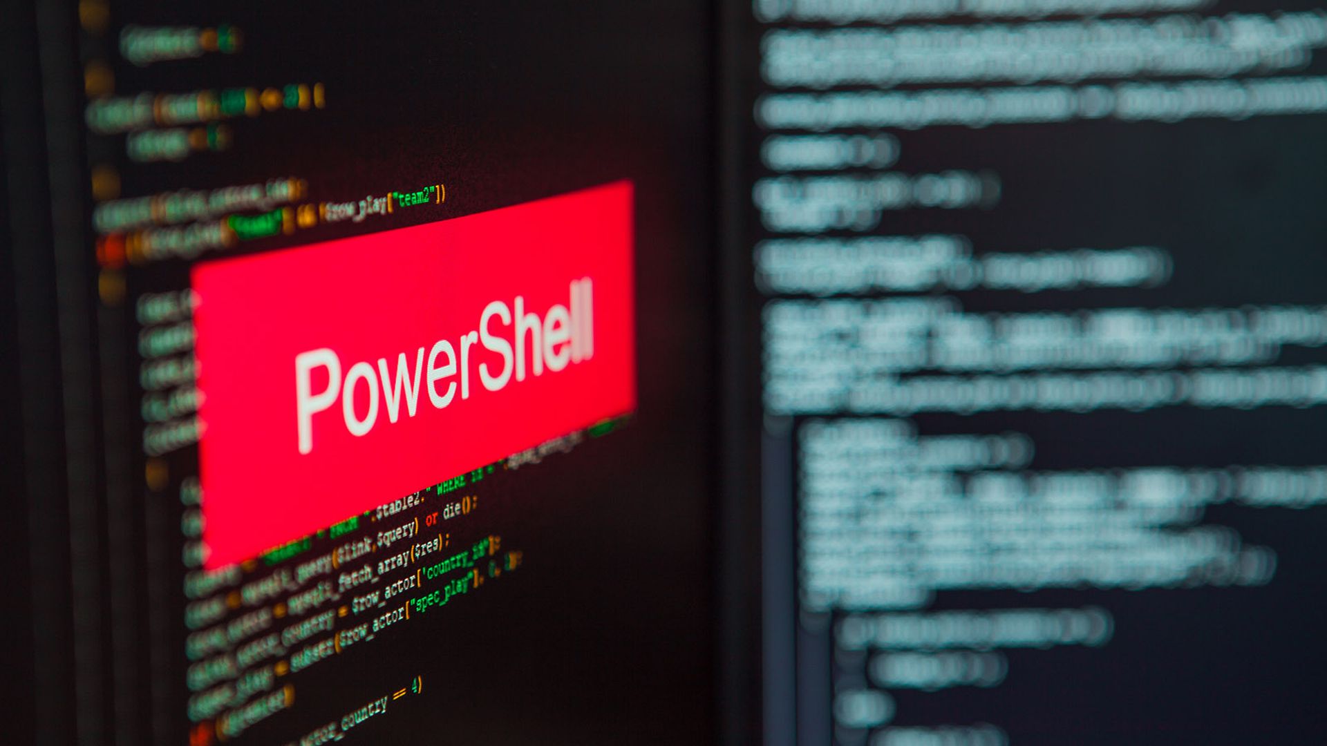 PowerShell inscription on the background of computer code.