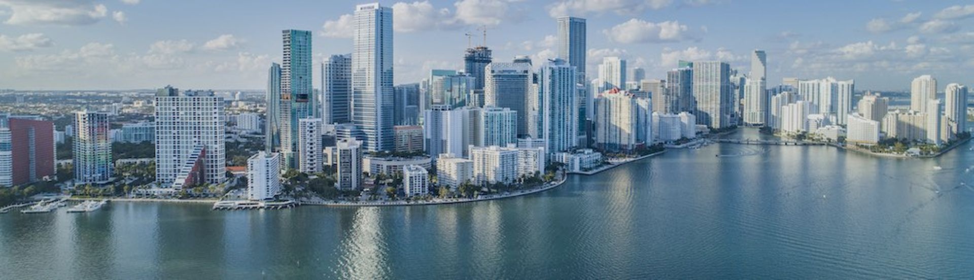 An aerial shot of Brickell Key, with downtown cityscape.