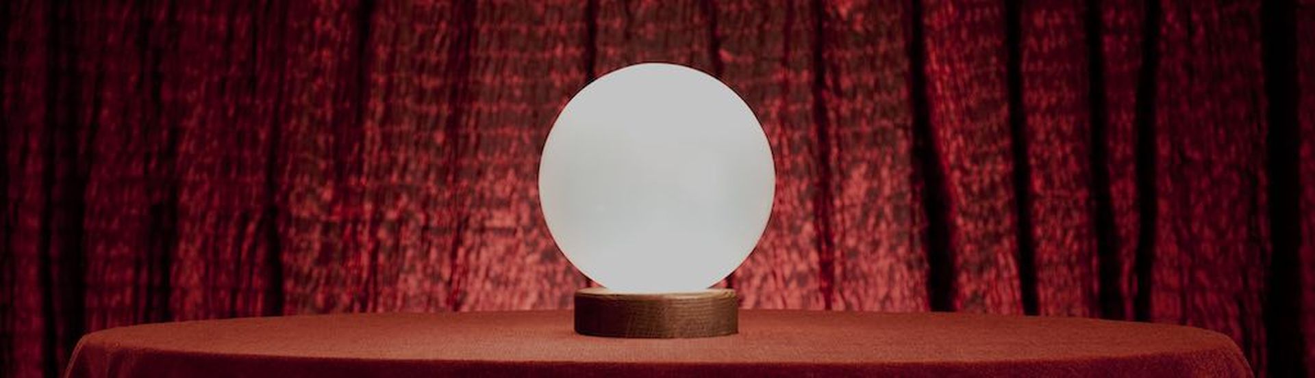 Glowing Crystal ball on a table &#8211; plenty of copy space area.