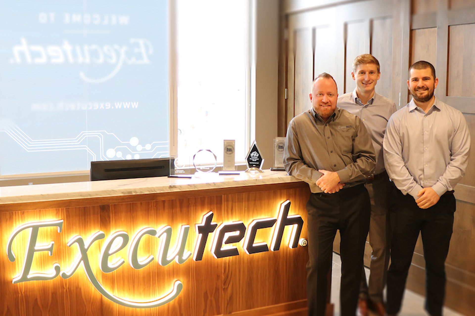 Executech CEO Eric Montague with Evergreen CEO Tim Totten and M&#038;A Head Ramsey TK.