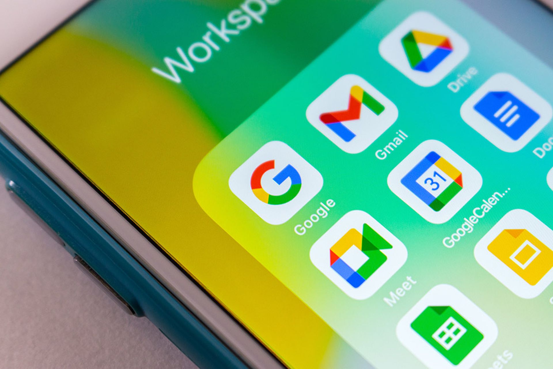 Closeup Google app with Google Workspace apps (Gmail, Google Calendar, Docs etc) on iPhone.