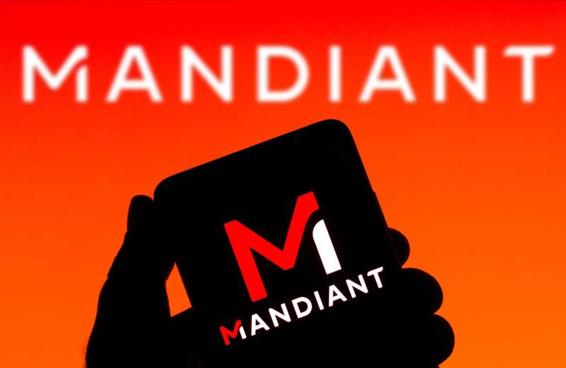 In this photo illustration the Mandiant logo seen displayed on a smartphone and on the background. (Photo Illustration by Rafael Henrique/SOPA Images/LightRocket via Getty Images)