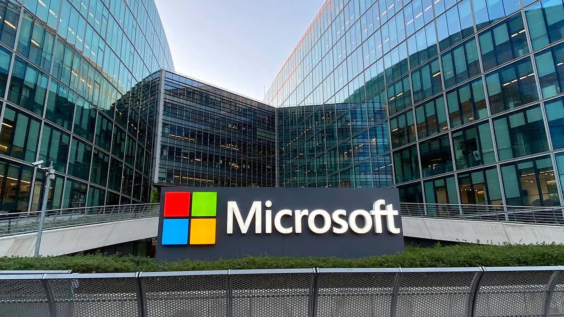A sign with the red, green, blue and yellow Microsoft logo is seen outside a building