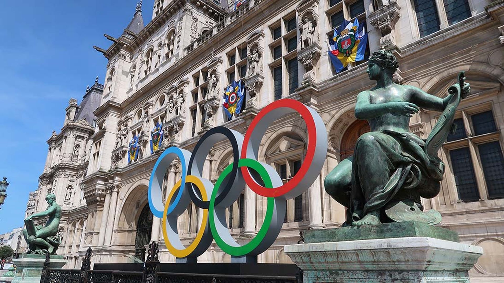 The multi-colored, intertwined Olympic rings are seen outside a hotel in Paris