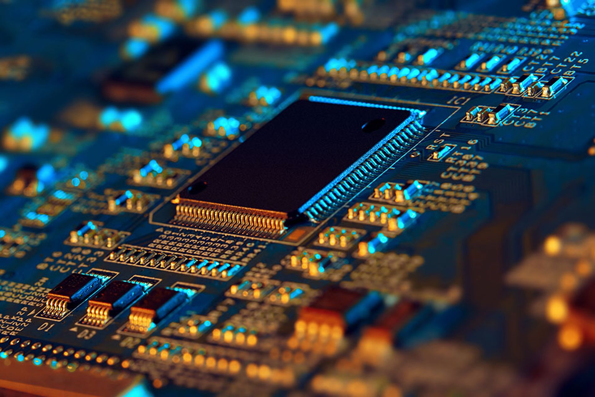 Electronic circuit board with electronic components such as chips close up.