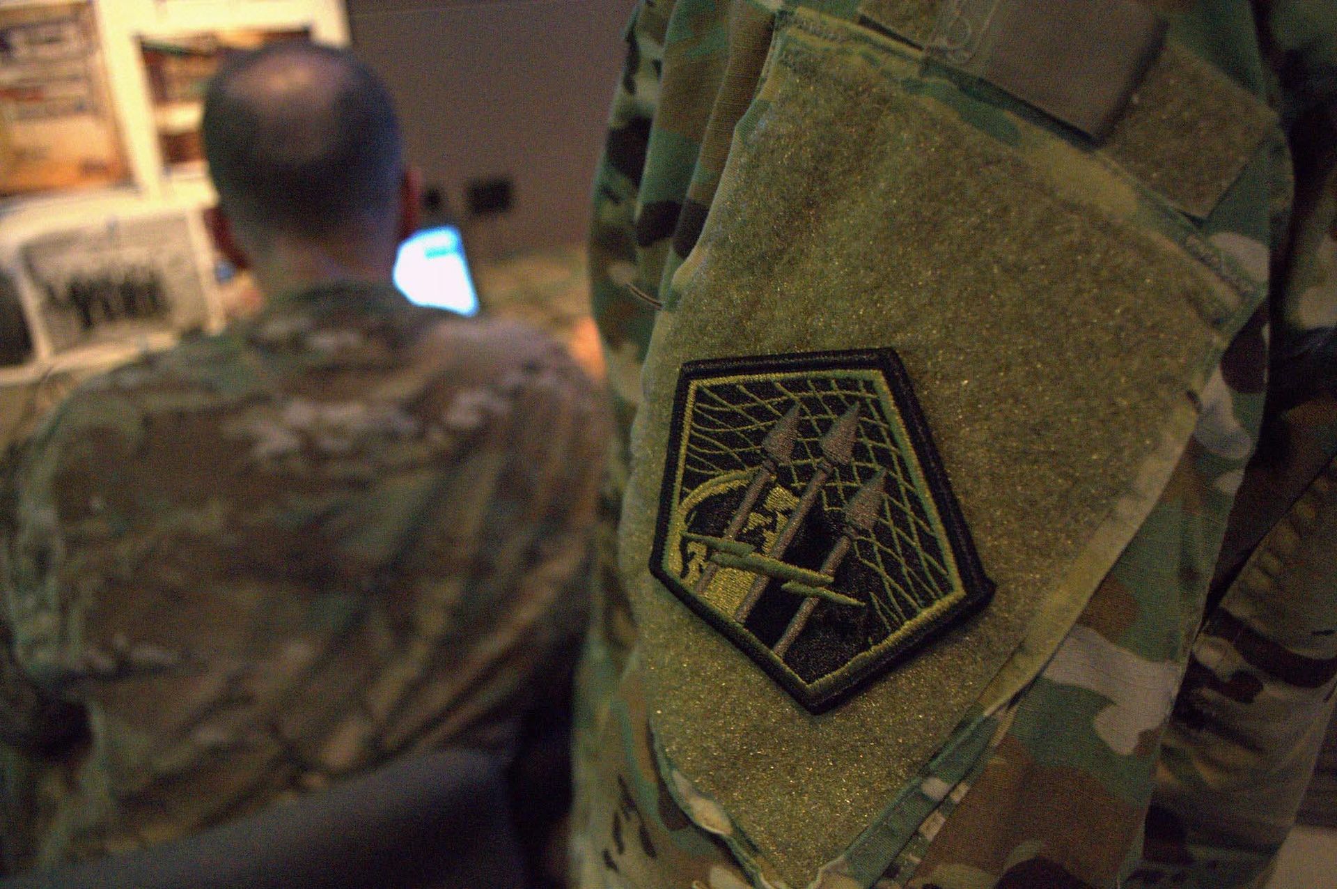 The Army Cyber Command patch is seen on the sleeve of a soldier