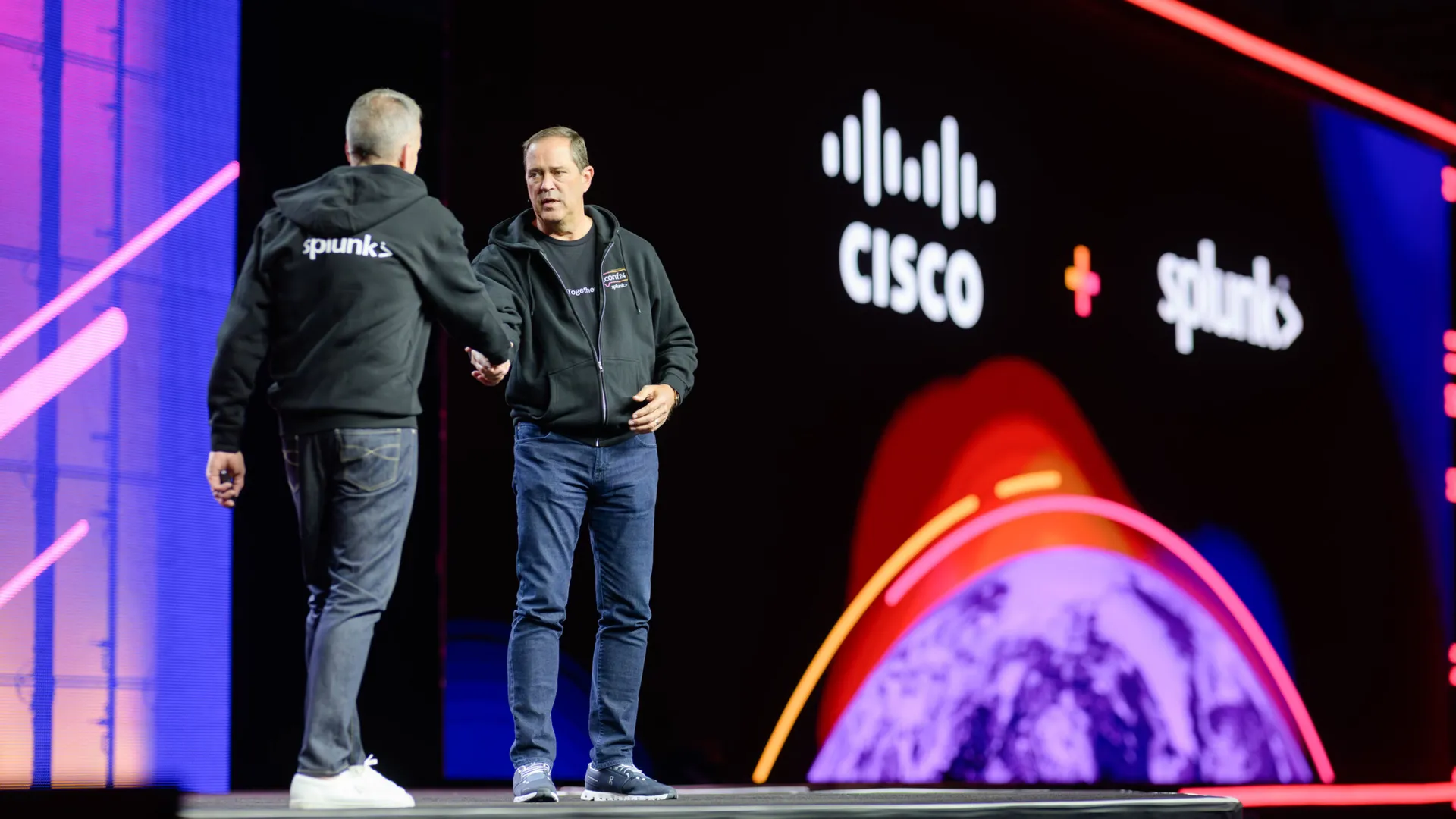 From left, Cisco Go-to-Market President and Splunk GM Gary Steele joins Cisco CEO and Chair Chuck Robbins on stage to discuss new product offerings during Splunk .conf24.