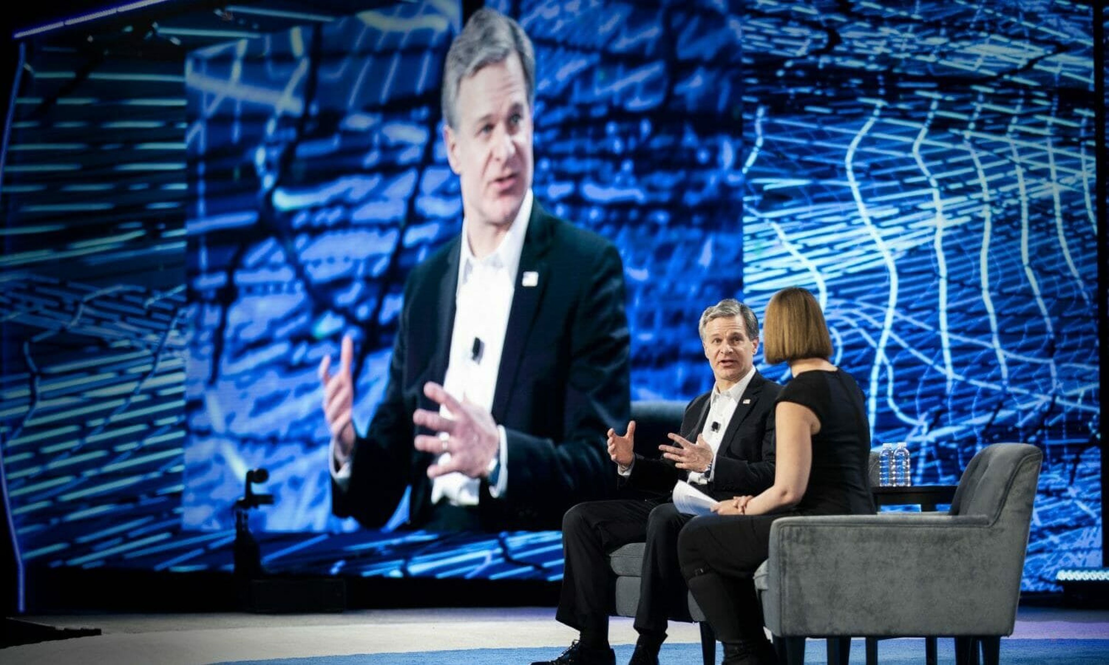 FBI Director Christopher Wray participates in a discussion with Brookings Institute security analyst Susan Hennessey during the RSA Conference on March 5, 2019, in San Francisco, California. As recently as January, the FBI has warned the private sector of the so-called Maze ransomware group. (FBI)