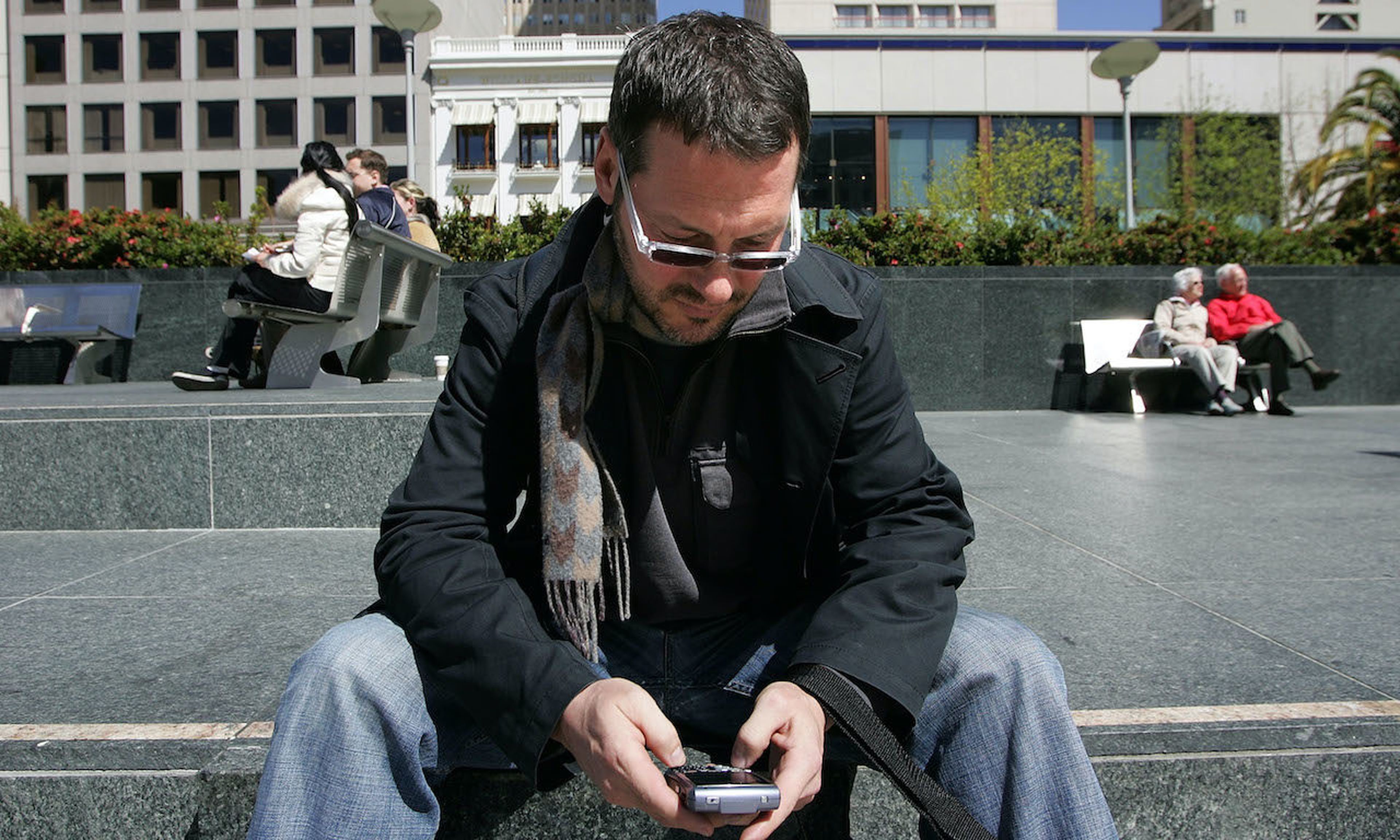 BlackBerry user Douglas Philips checks emails on his BlackBerry in 2007 in San Francisco, California. A new tool available on the dark web allows cyberattackers to abuse a special feature of the Internet Message Access Protocol used for remote email access.  (Photo by Justin Sullivan/Getty Images)