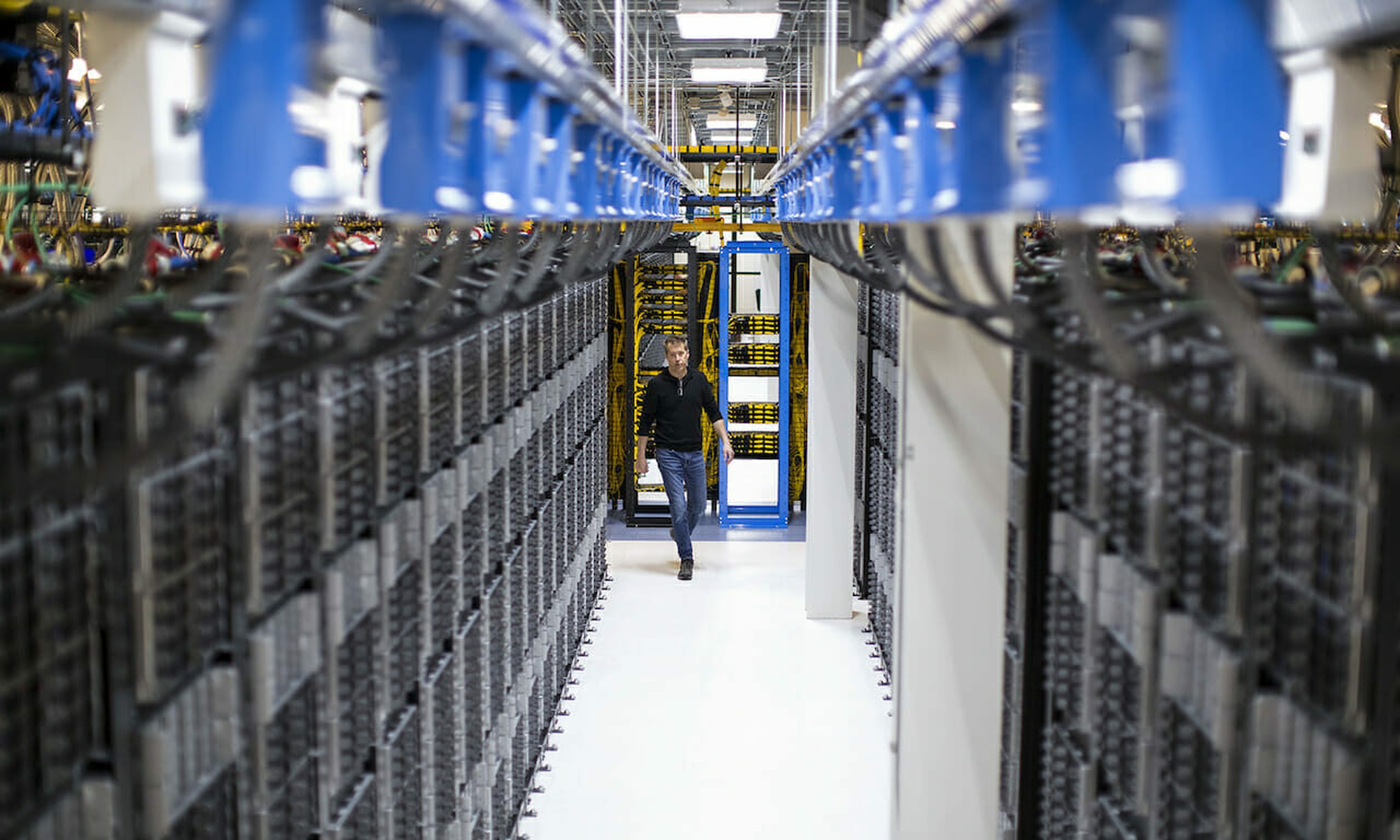 A man walks through a Microsoft server farm in Switzerland. (Amy Sacka for Microsoft)