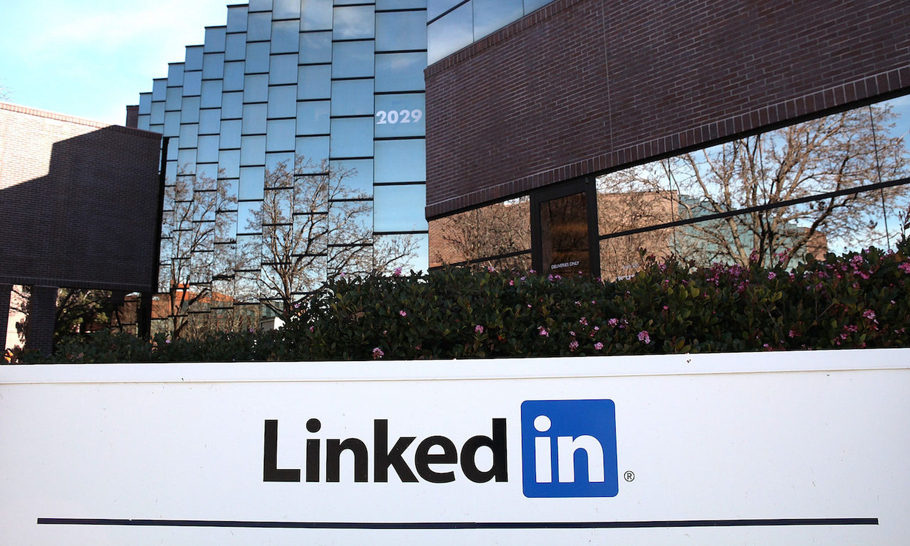 A sign is posted in front of the LinkedIn headquarters in Mountain View, California. (Photo by Justin Sullivan/Getty Images)