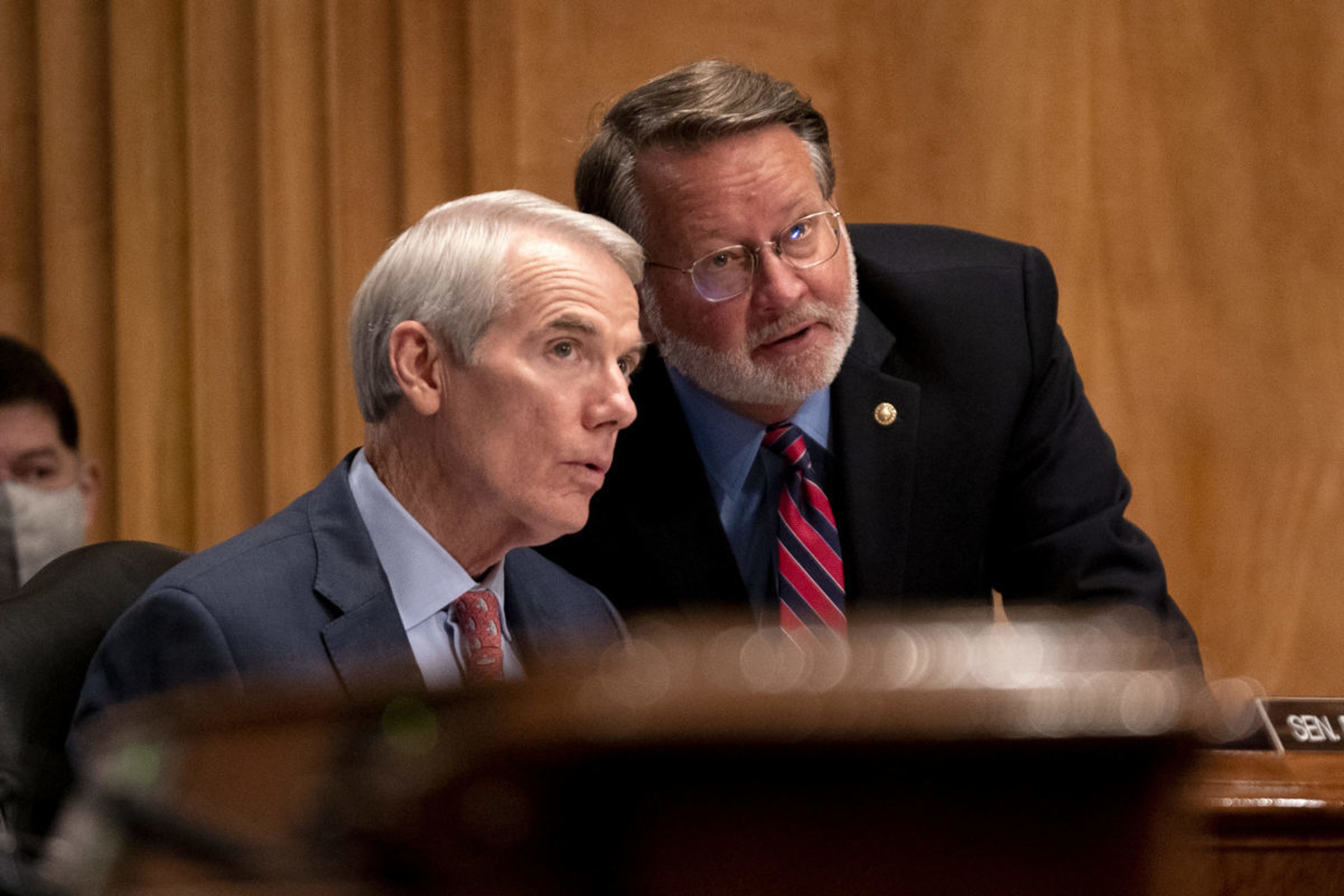Sen. Rob Portman, R-Ohio, left, speaks to Sen. Gary Peters, D-Mich., at a hearing to discuss security threats 20 years after the 9/11 terrorist attacks at the U.S. Capitol on Sept. 21, 2021, in Washington. A provision based on the lawmakers&#8217; cyber incident reporting legislation passed has passed both houses of Congress and is now expected to ...