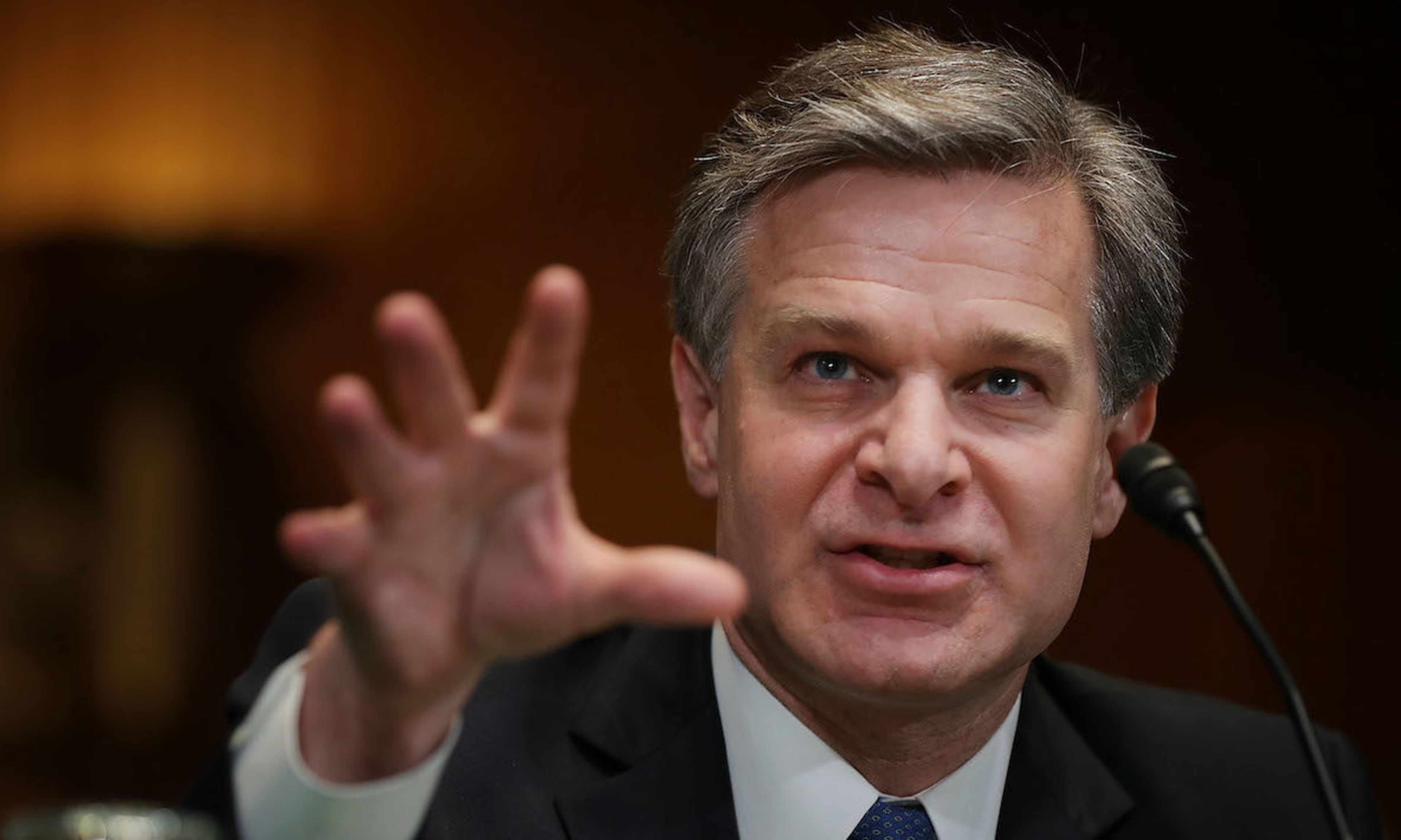FBI Director Christopher Wray testifies before the Senate in May 2018. Wray endorsed the concept of a cyber incident reporting bill but said the FBI had a number of issues with the way that reporting would be structured. (Photo by Chip Somodevilla/Getty Images)