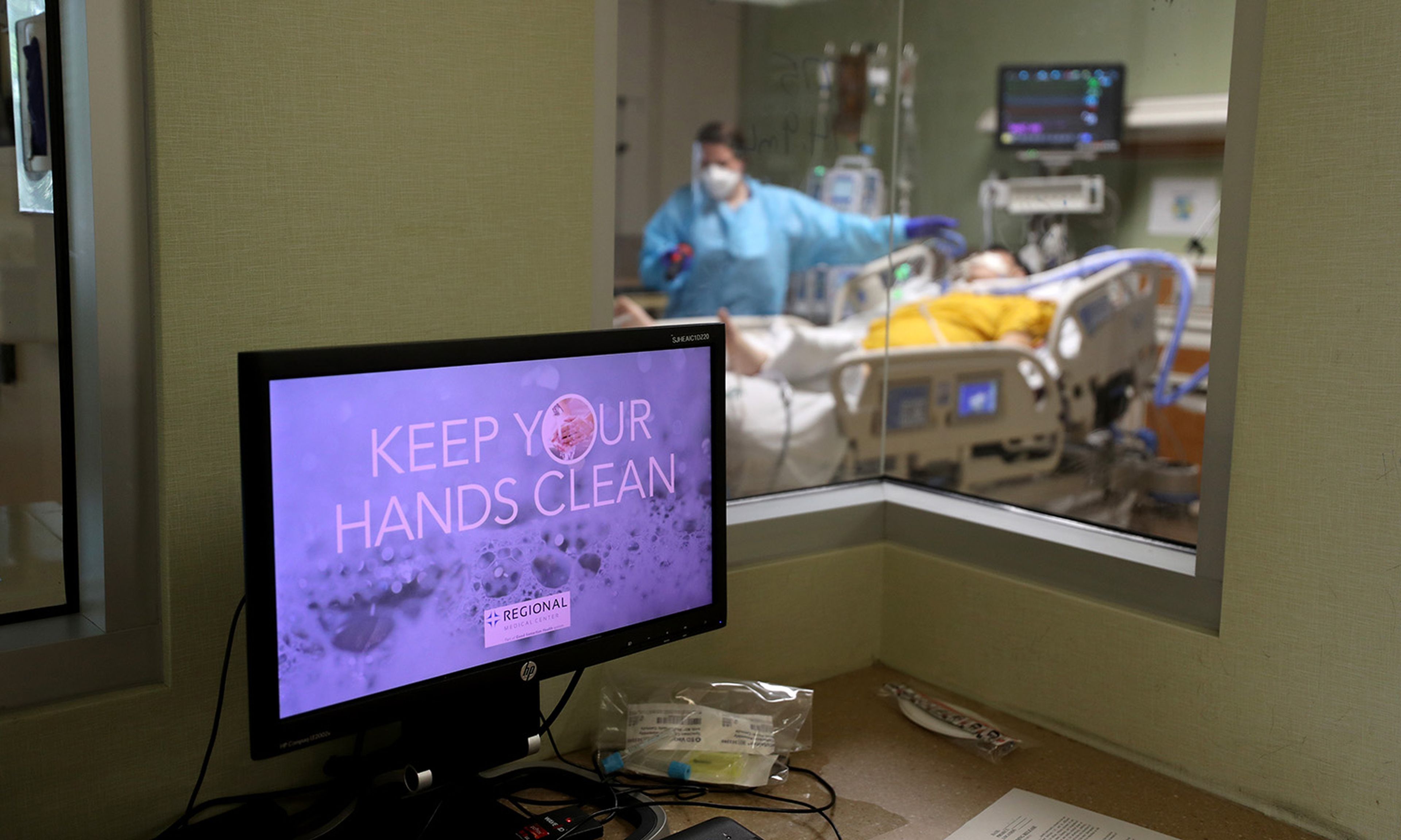 A message about hand-washing is displayed on a computer monitor in the intensive care unit at Regional Medical Center on May 21, 2020, in San Jose, Calif. (Photo by Justin Sullivan/Getty Images)