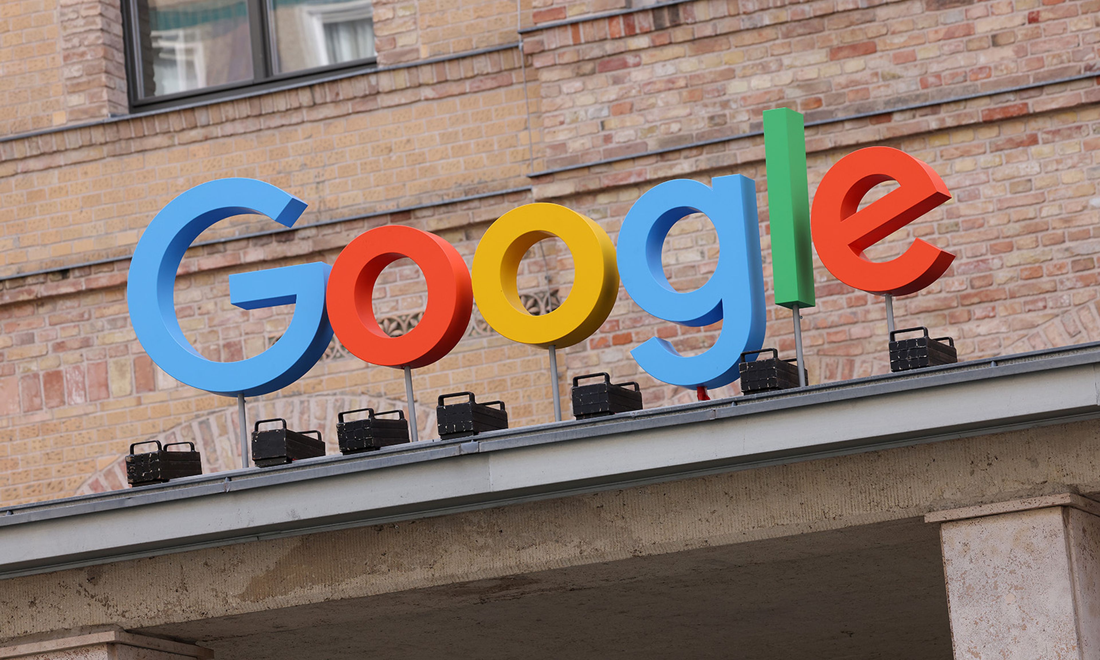 The Google corporate logo hangs outside the Google Germany offices on Aug. 31, 2021, in Berlin. (Photo by Sean Gallup/Getty Images)