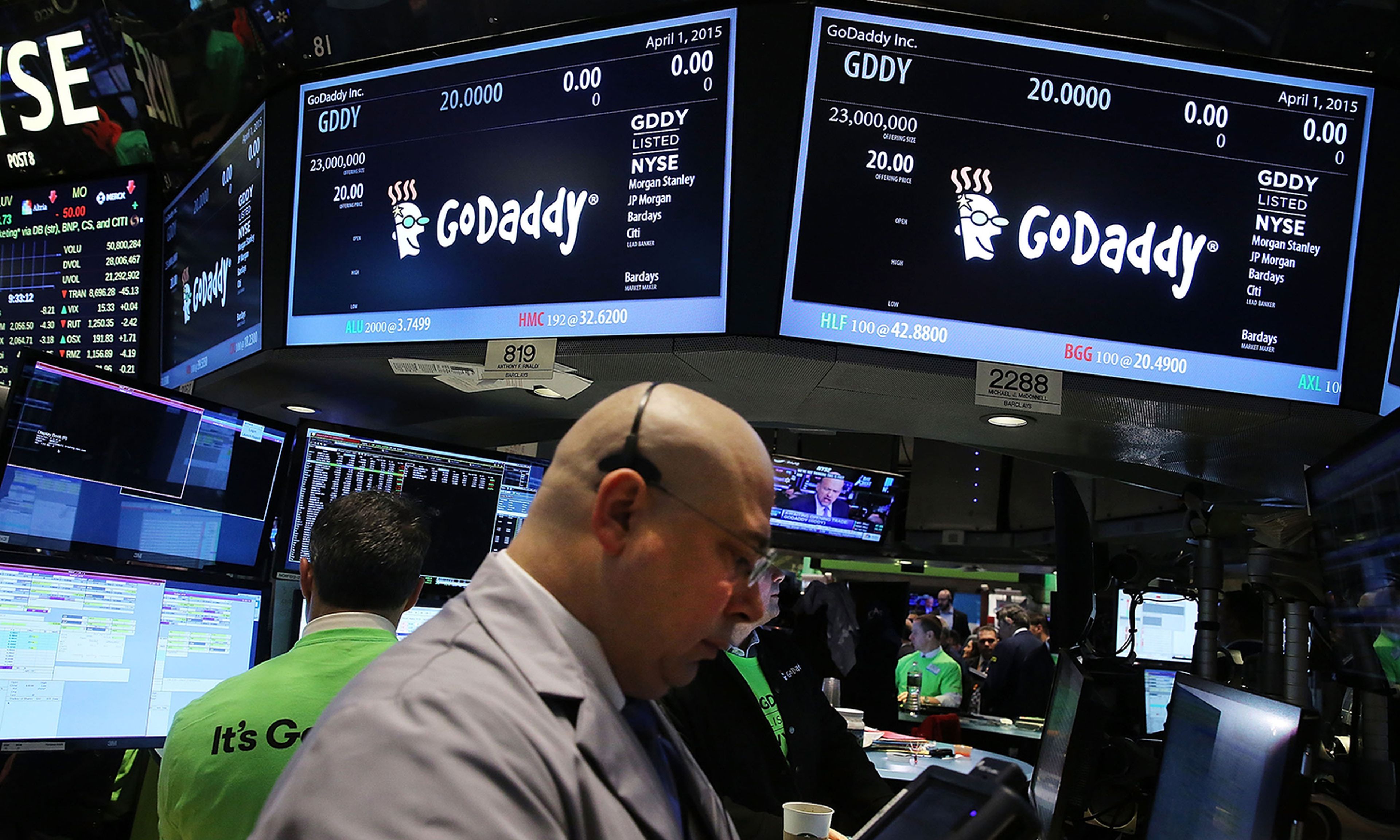 Traders work on the floor of the New York Stock Exchange as the website hosting service GoDaddy makes its initial public offering (IPO) on April 1, 2015, in New York City. (Photo by Spencer Platt/Getty Images)