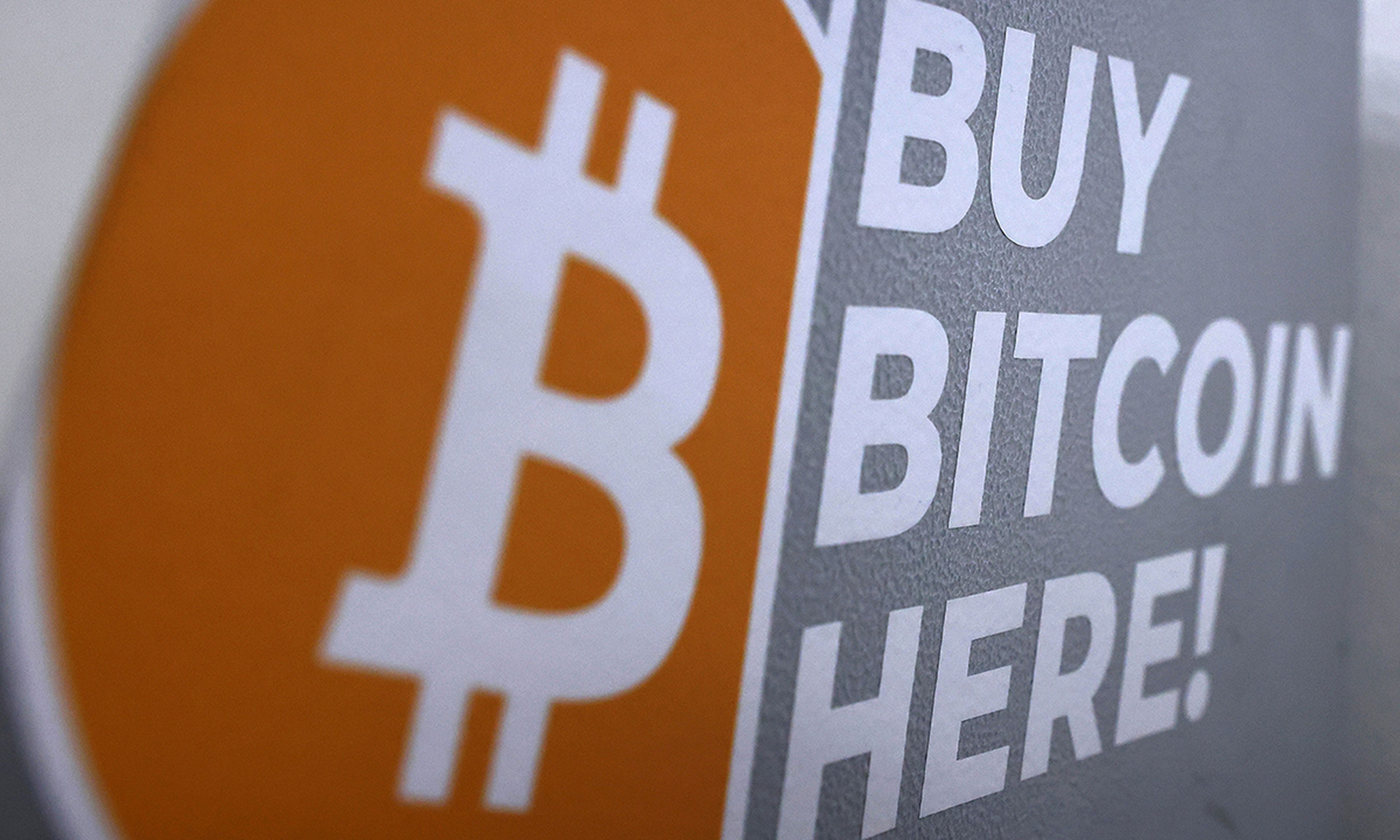 The Bitcoin logo is displayed on the side of a Bitcoin ATM on Nov. 10, 2021, in Los Angeles. (Photo by Mario Tama/Getty Images)
