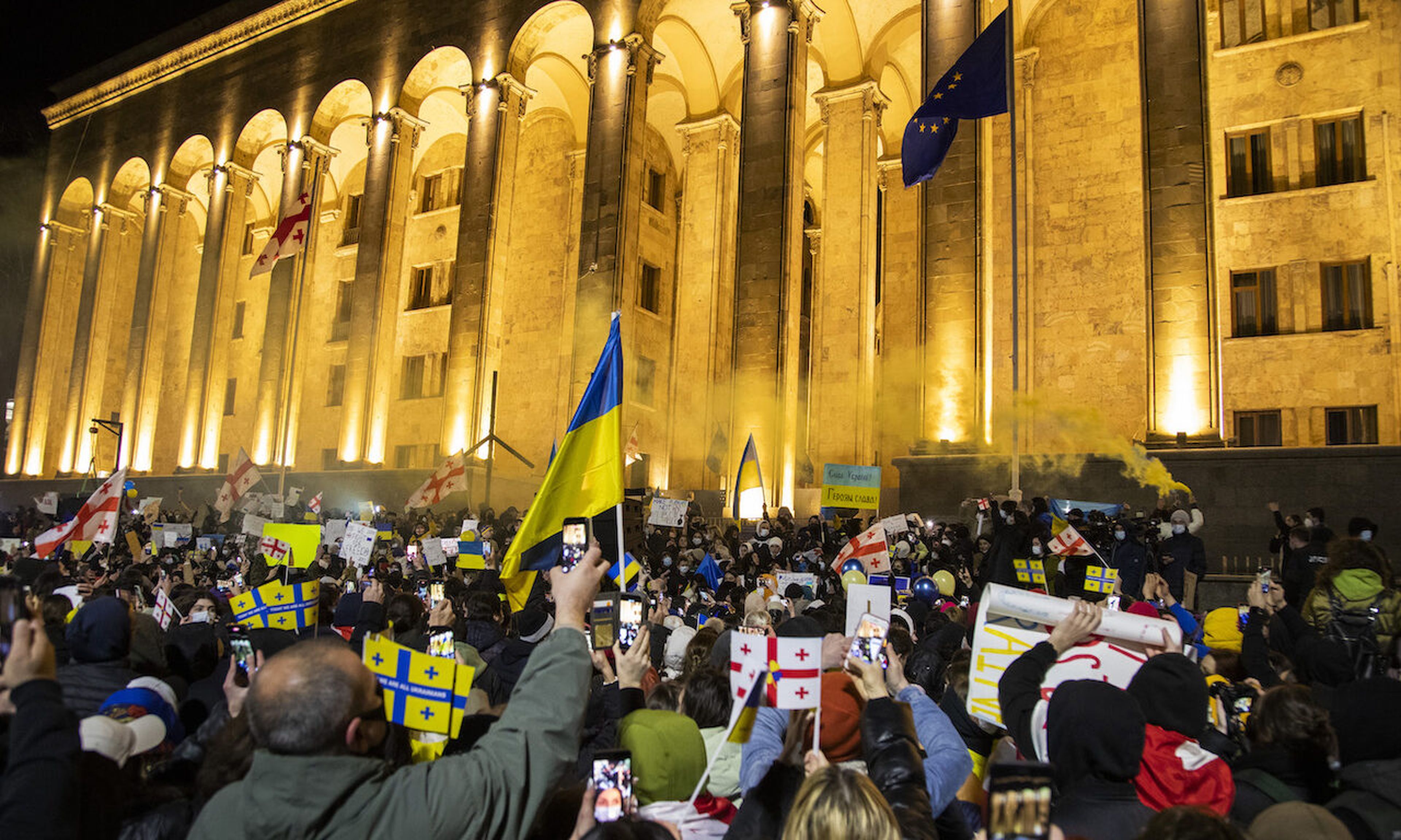 Georgians rally in support of Ukraine held in front of the Parliament demanding that Russian President Putin ends the war. Ransomware gangs have retaliated against the Russia-based Conti group after threatening attacks to Western countries that target Russia. (Photo by Daro Sulakauri/Getty Images)