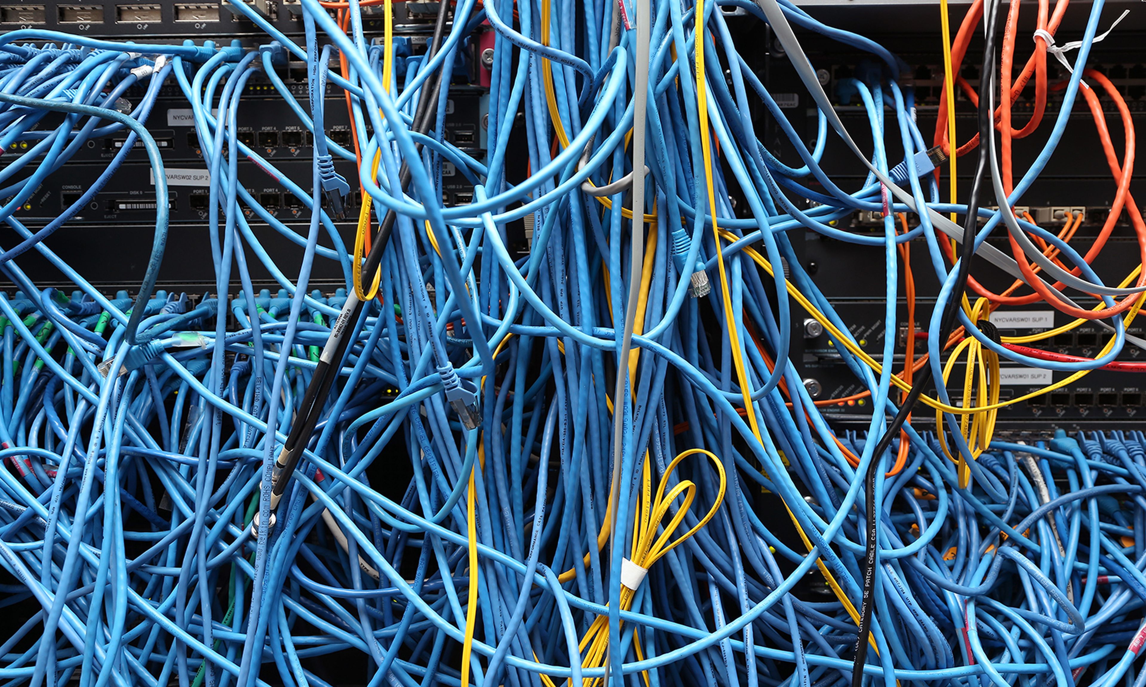 Network cables are plugged in a server room in New York City. (Photo by Michael Bocchieri/Getty Images)