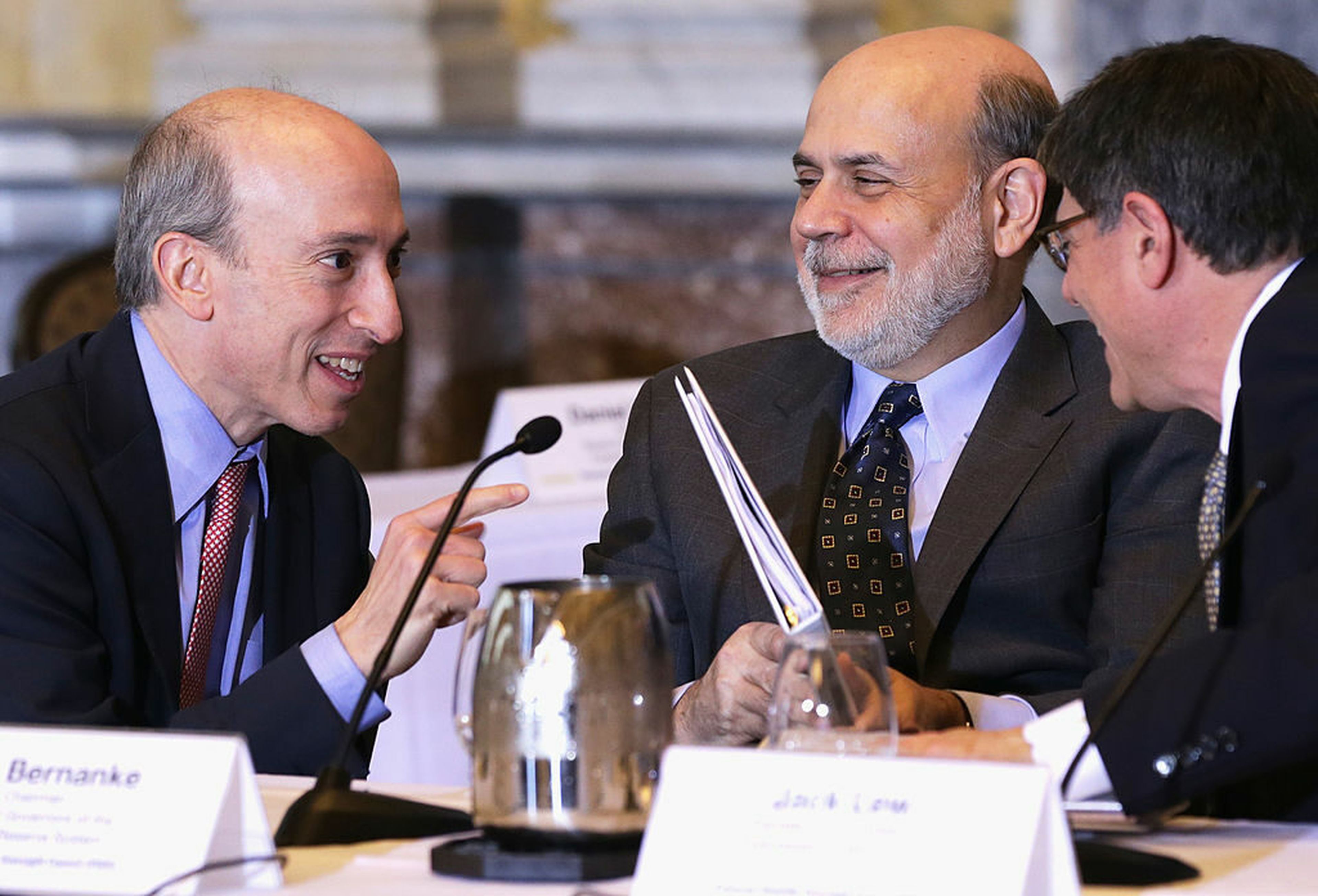 Securities and Exchange Commission Chair Gary Gensler (Left) speaks with Federal Reserve Board Chairman Ben Bernanke (Middle) and U.S. Secretary of the Treasury Jacob Lew (Right). The Securities and Exchange Commission formally proposed a new set of regulations that would impose sweeping transparency requirements around the cybersecurity operations...