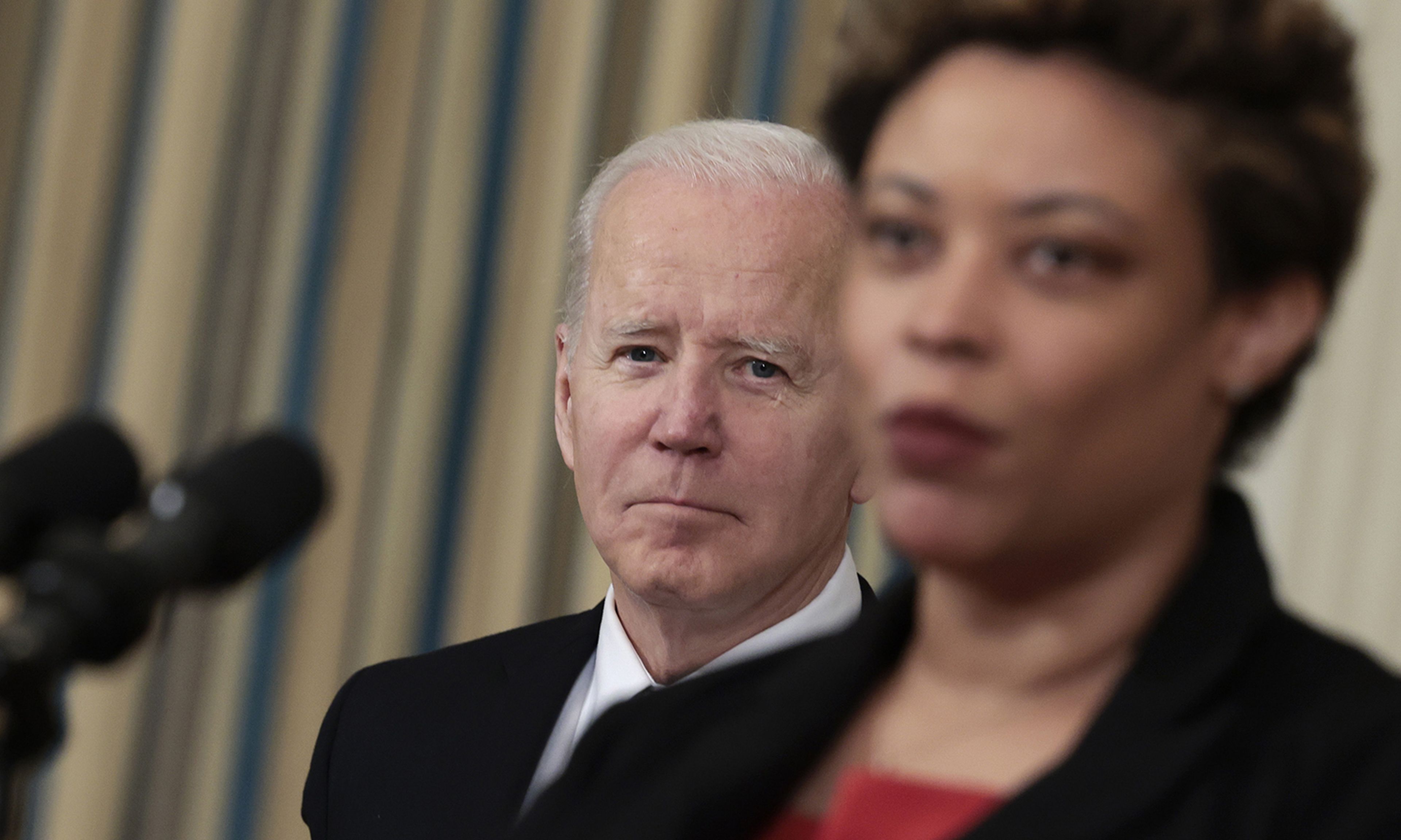 President Joe Biden listens as Director of the Office of Management and Budget Shalanda Young introduces him before speaking on his budget for Fiscal Year 2023 at the White House on March 28, 2022, in Washington.
