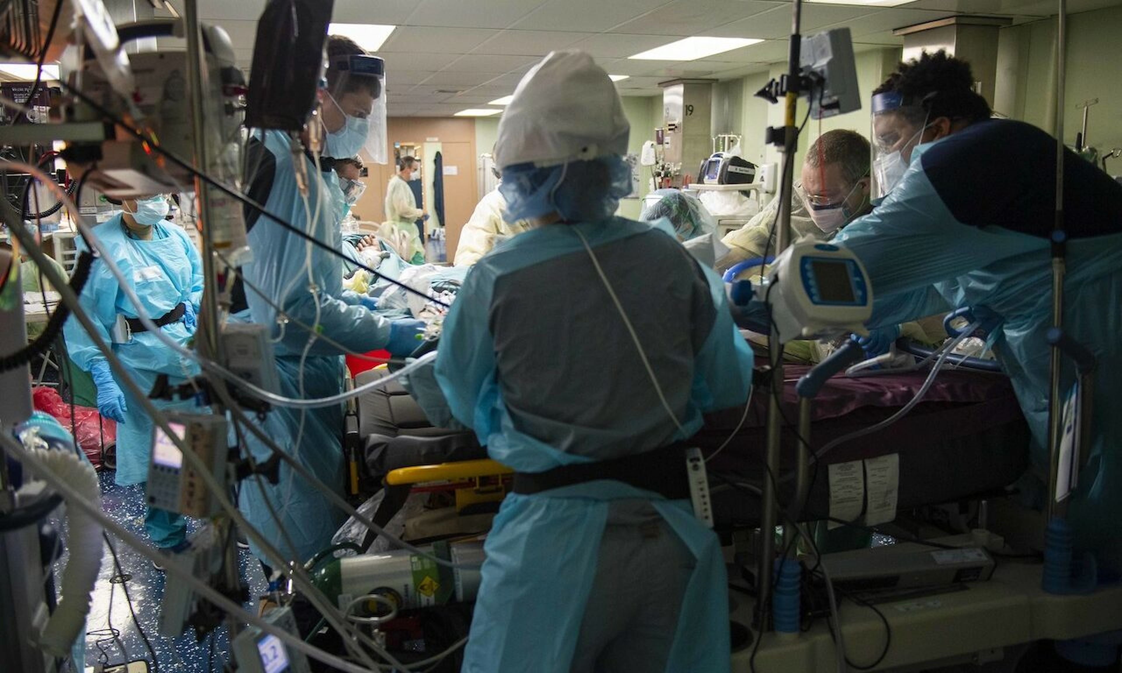 Paramedics prepare a patient for transport in the intensive care unit aboard the hospital ship USNS Comfort (T-AH 20). (U.S. Navy photo by Mass Communication Specialist 2nd Class Sara Eshleman)