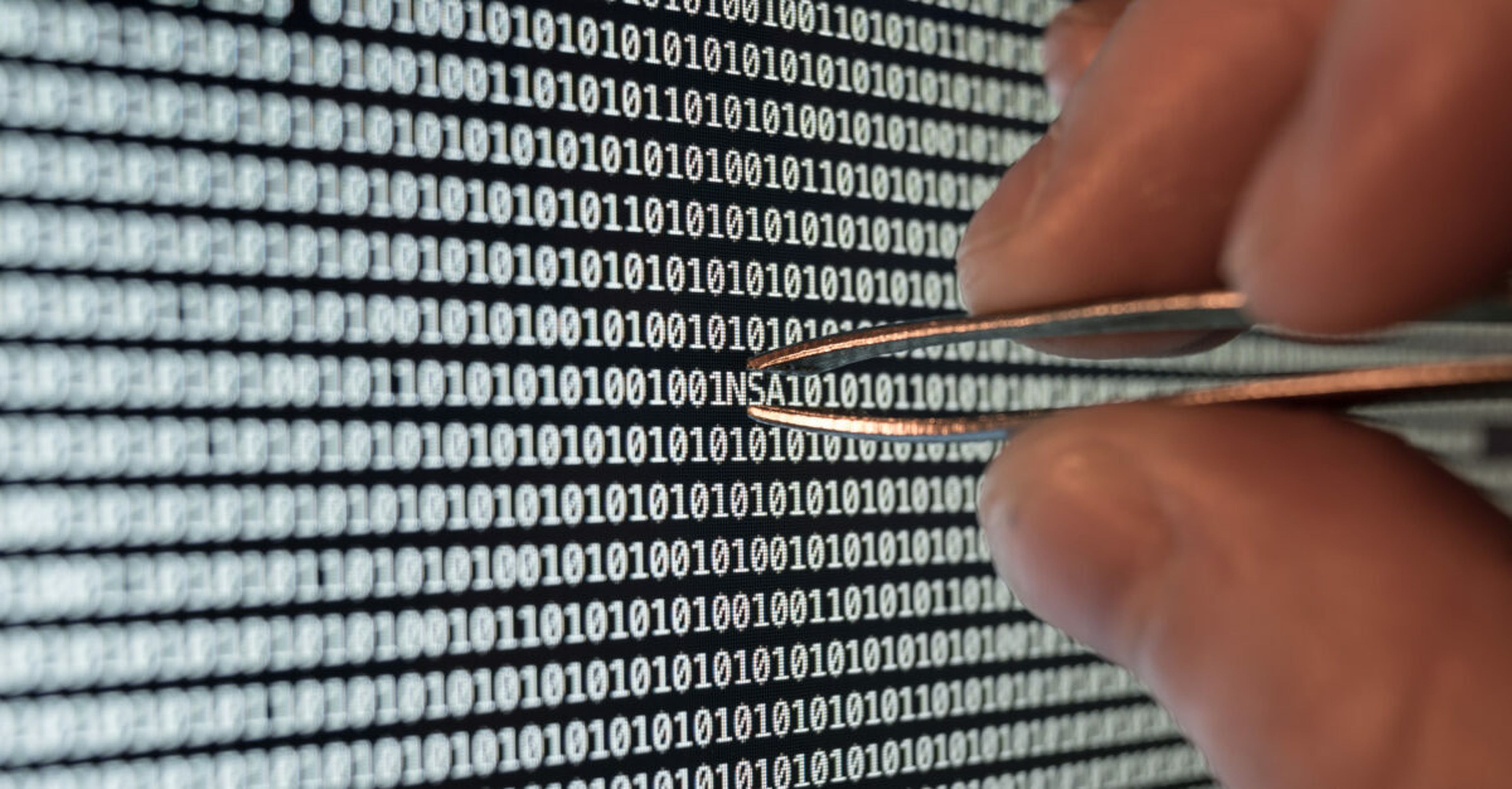 Binary code, taking out the nsa with tweezers. At the RSA conference, Rob Joyce, director of cybersecurity at the National Security Agency said says there has been “enormous” amount of hacking in the Russia-Ukraine war. (Image Credit: MysteryShot via Getty)
