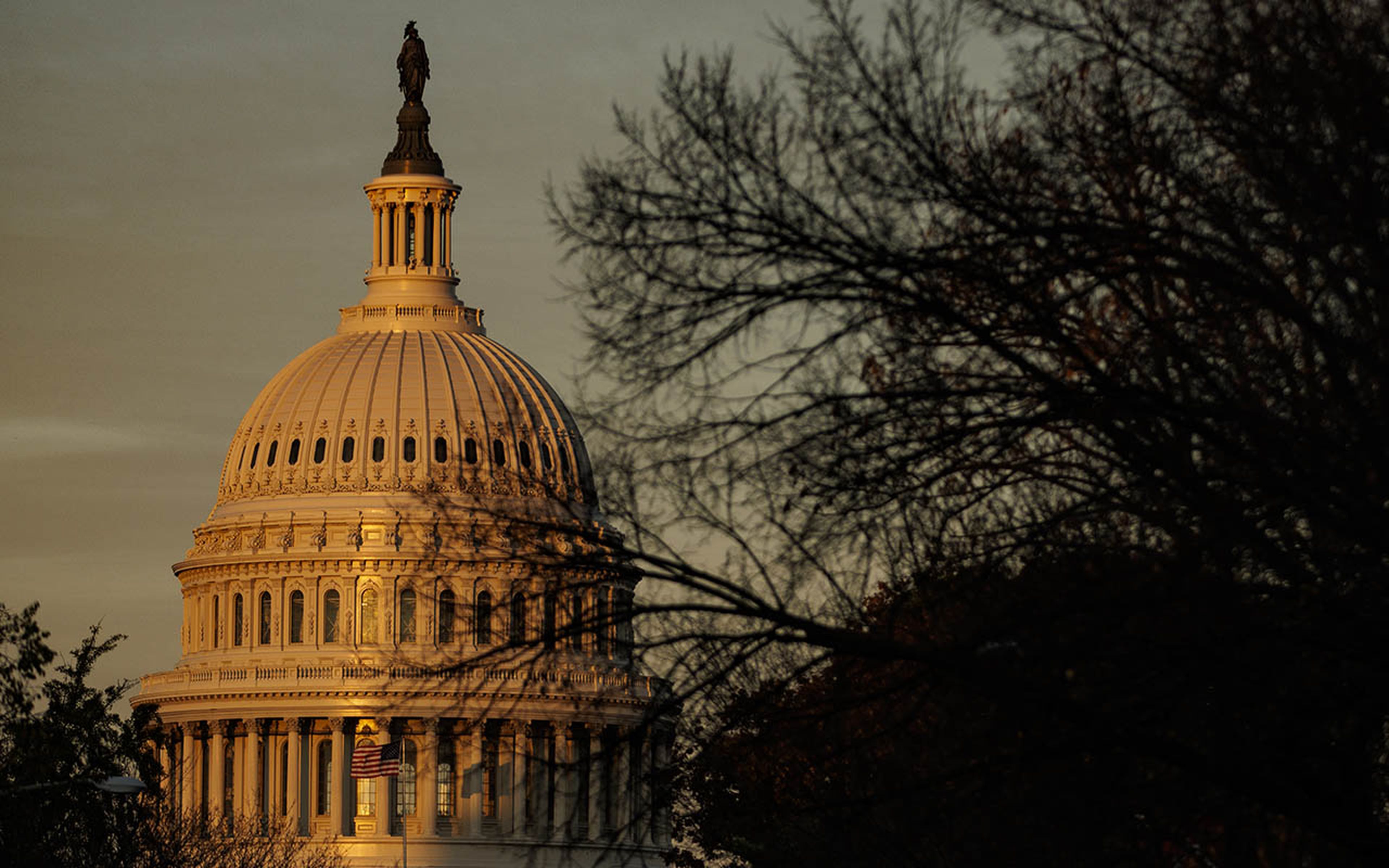 The rising sun strikes the U.S. Capitol dome