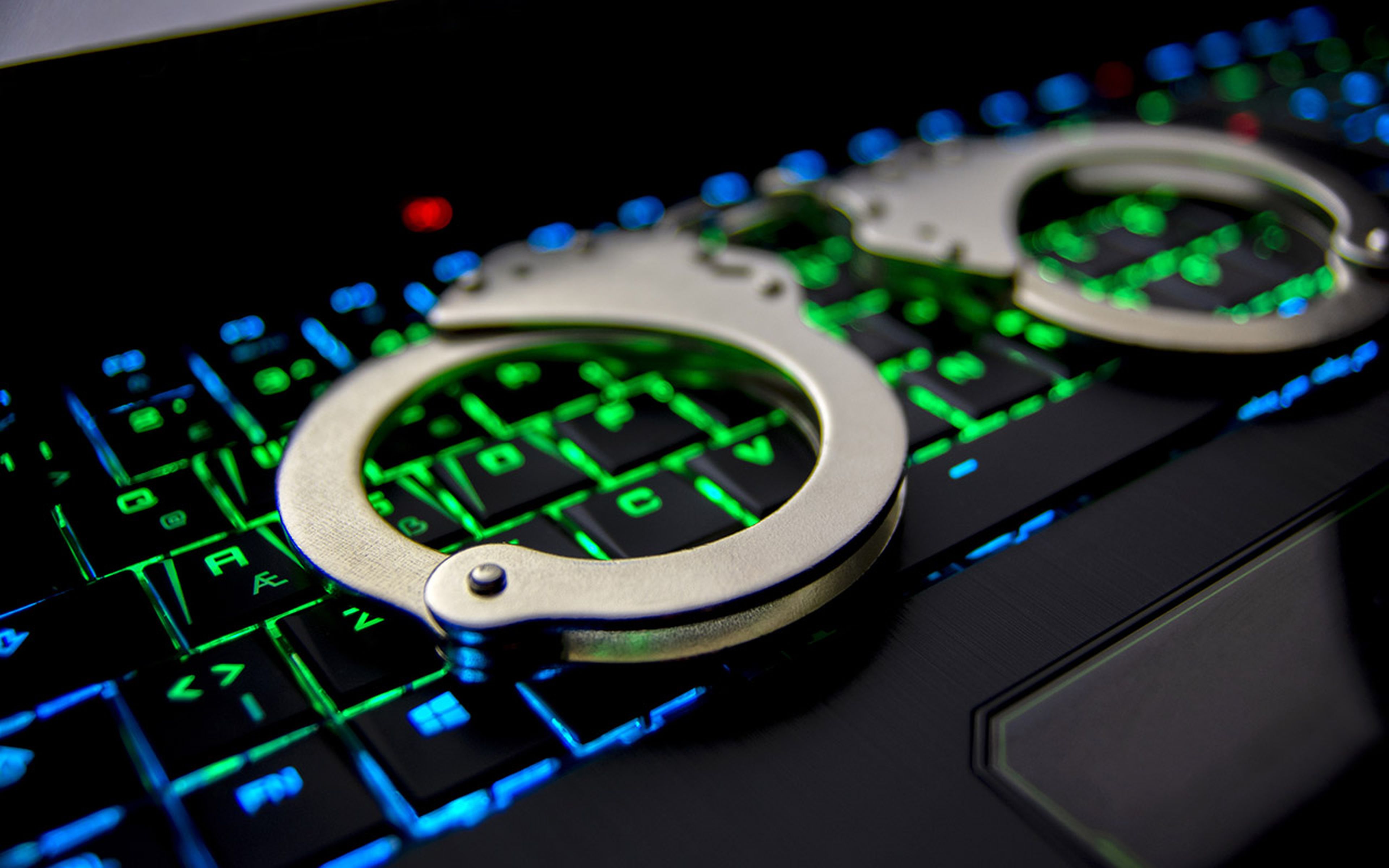 A colorful keyboard and handcuffs.