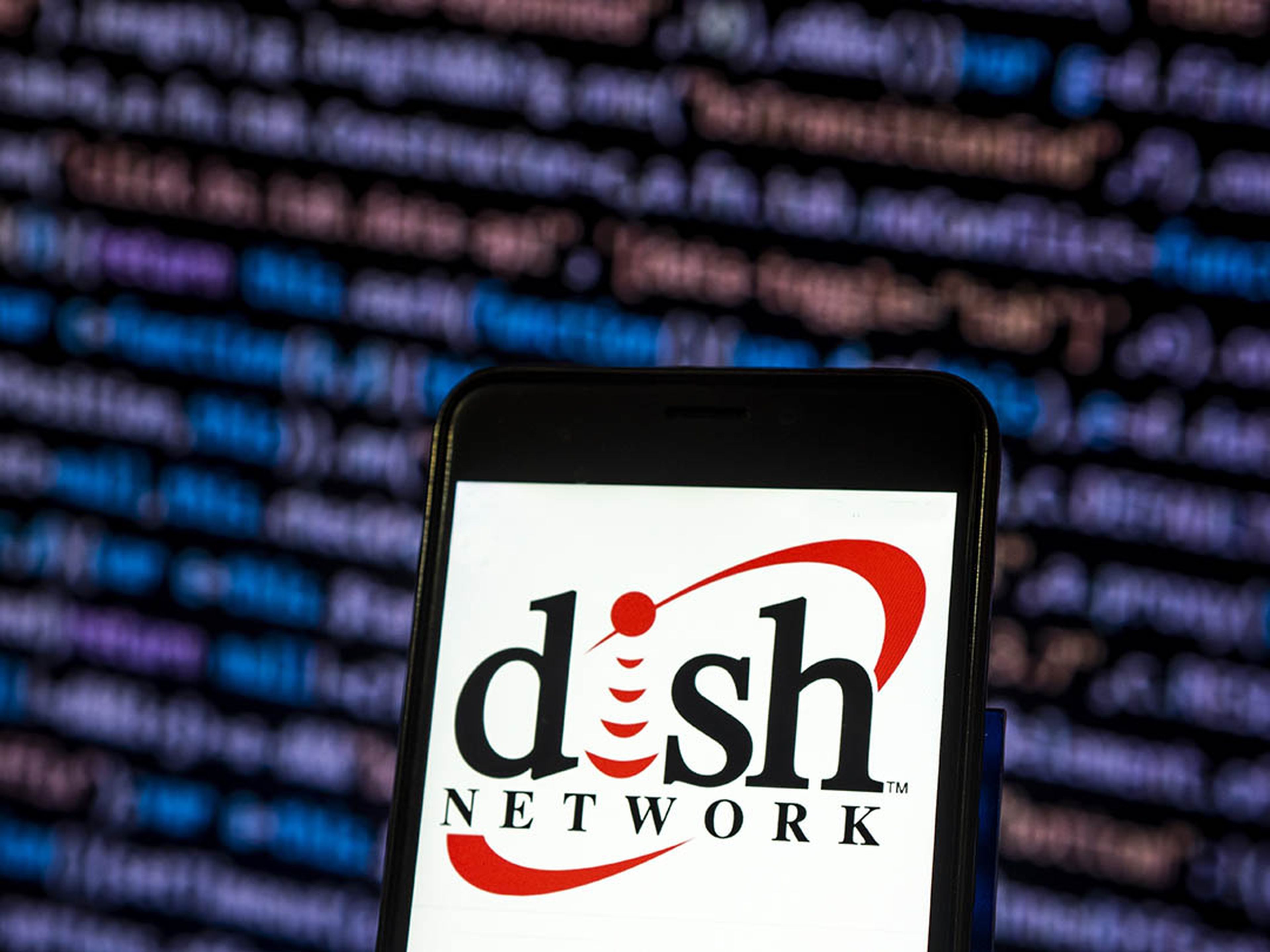 KIEV, UKRAINE &#8211; 2018/11/14:  In this photo illustration, the Dish Network Satellite television company logo seen displayed on a smartphone. (Photo Illustration by Igor Golovniov/SOPA Images/LightRocket via Getty Images)