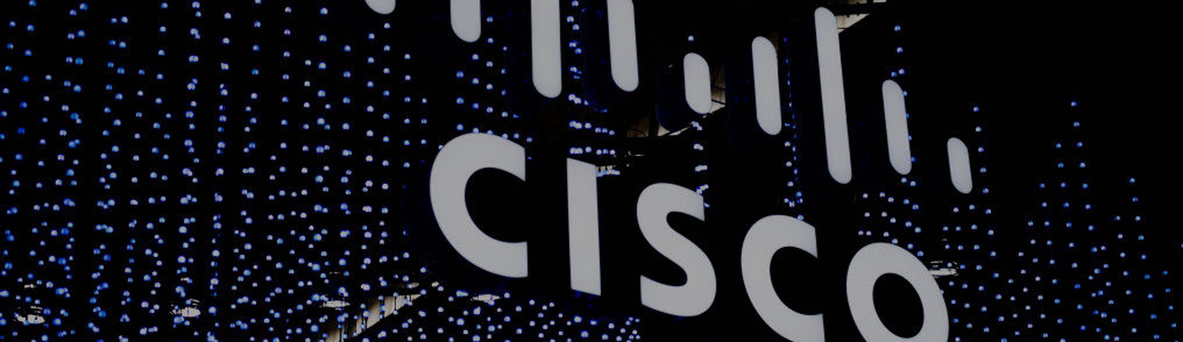 BARCELONA, SPAIN &#8211; FEBRUARY 28: A logo sits illuminated outside the Cisco booth at the SK telecom booth on day 1 of the GSMA Mobile World Congress on February 28, 2022 in Barcelona, Spain. The annual Mobile World Congress hosts some of the world&#8217;s largest communications companies, with many unveiling their latest phones and wearables ga...