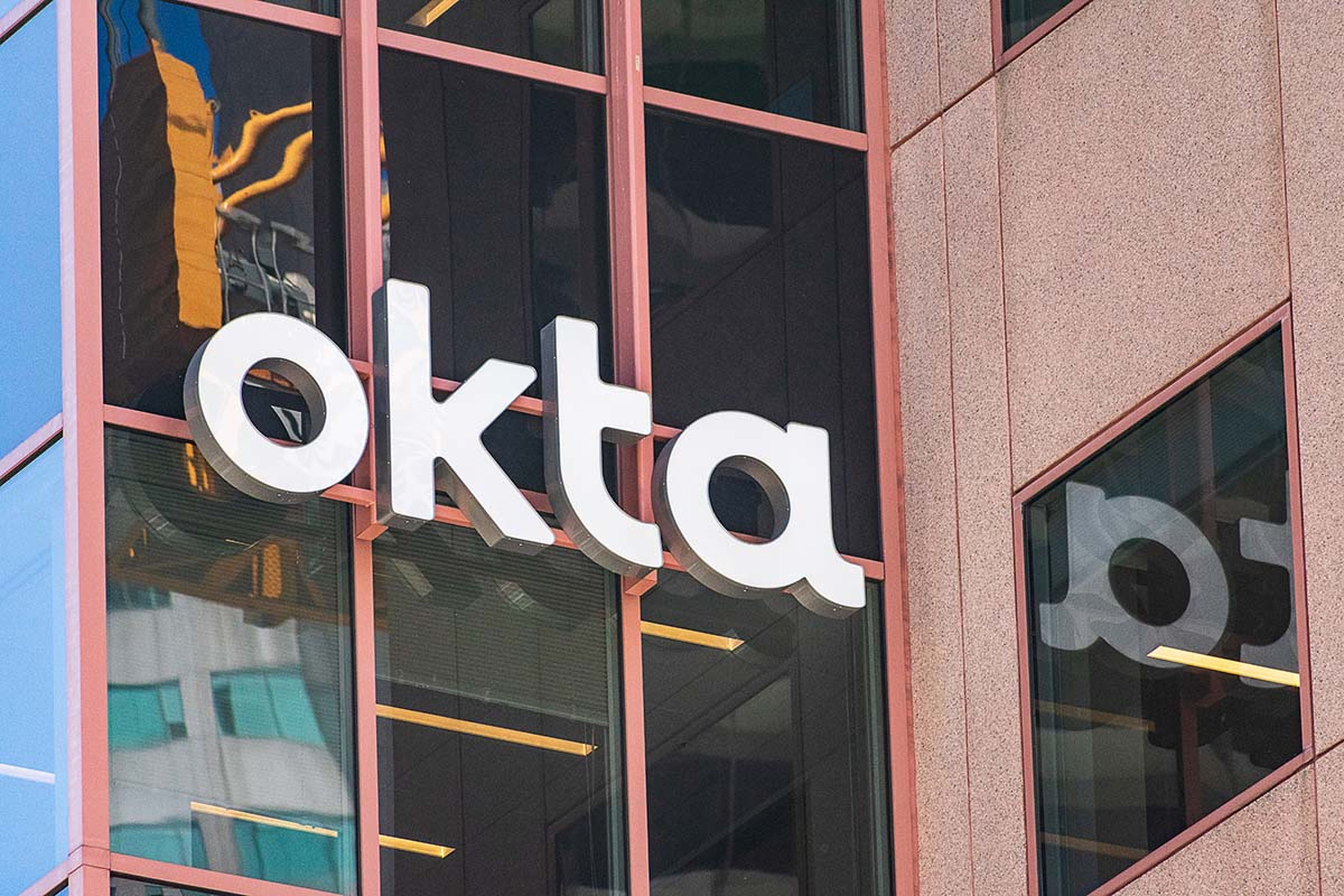 An Okta sign is seen on its headquarters in San Francisco.