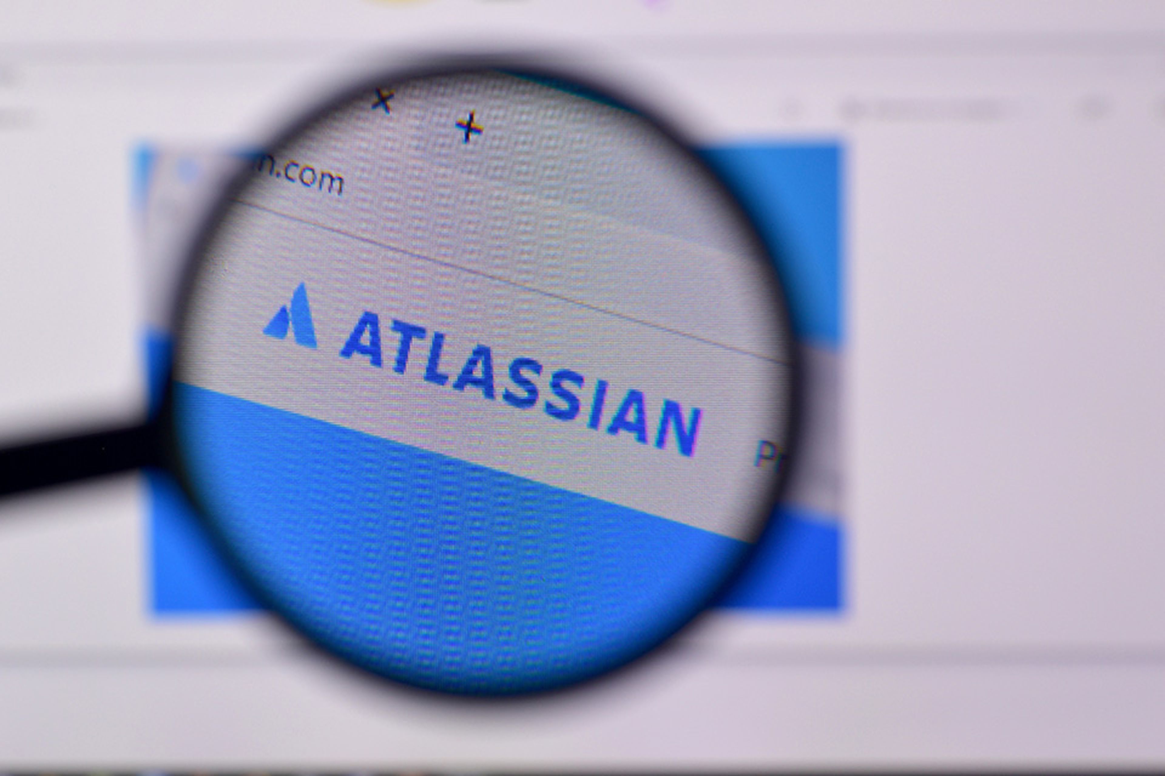 Homepage of atlassian website on the display of PC, url - atlassian.com.