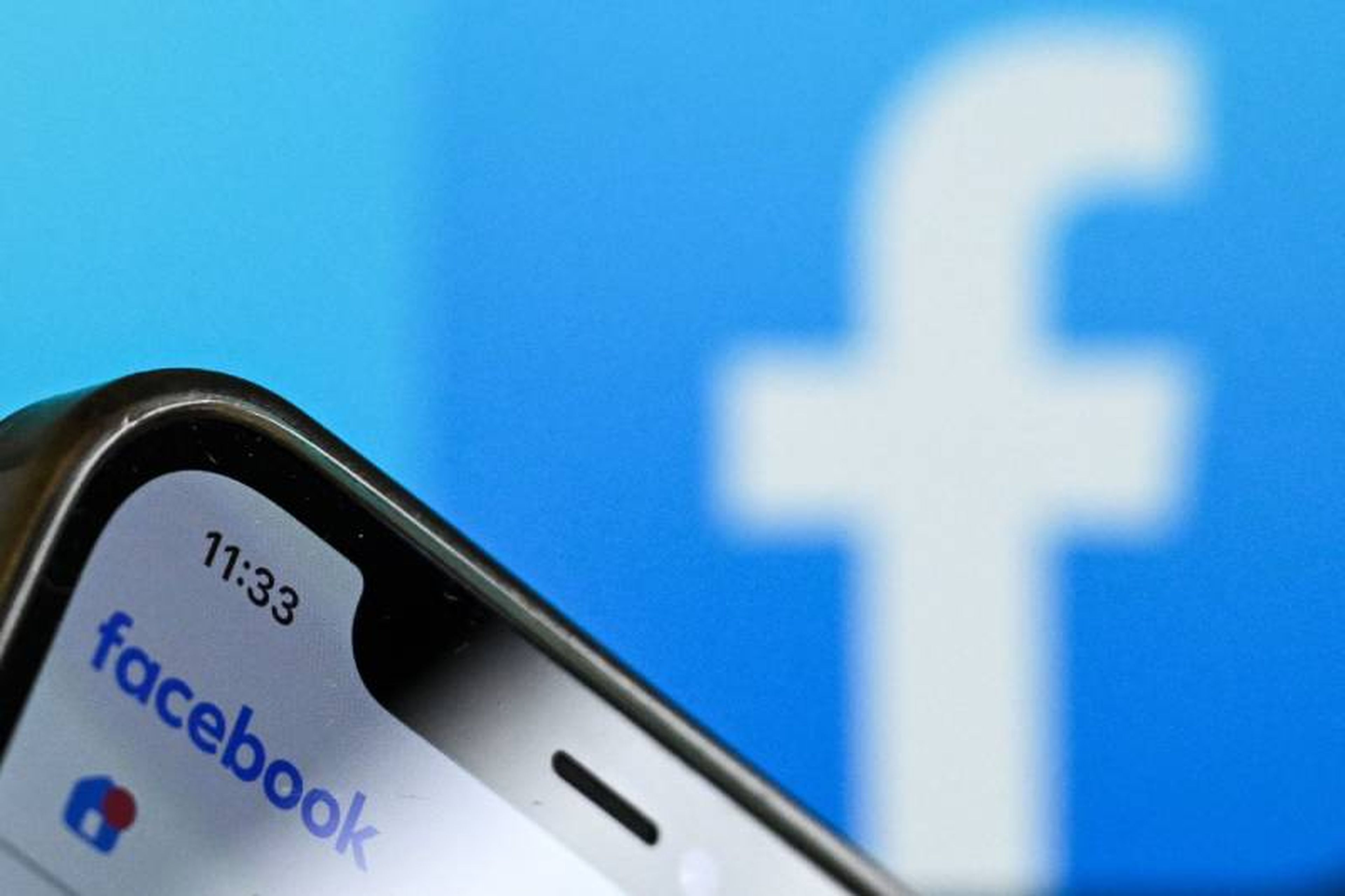 the logo of US online social media and social networking service Facebook on a smartphone screen