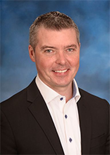 Jason Witty, eid 2N743, USAA employee, formal portrait, on blue, EA