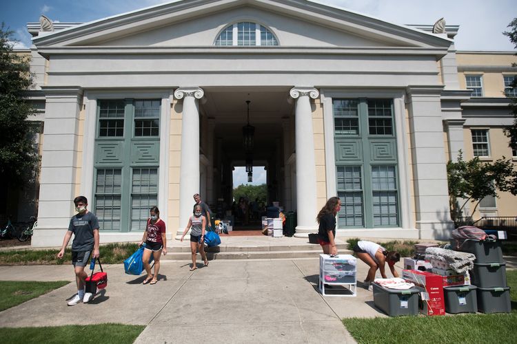 Students and their families carefully move belongings to a campus dormitory at the University of South Carolina, where classes are set to start on August 20. As IT and security pros juggle the new realities of COVID-19, they are relying on new cloud, IoT and artificial intelligence technologies to keep students, faculty and staff secure. (Photo by ...