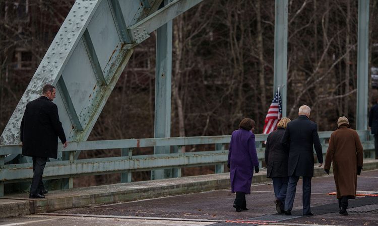 President Joe Biden walks along the New Hampshire 175 bridge in Woodstock, N.H., on November 16, the day after signing the $1.2 trillion infrastructure bill. Today’s columnist, Christina Hoefer of Forescout, writes that while President Biden had to build bridges to bring both political parties together, so too can IT and OT departments build relati...