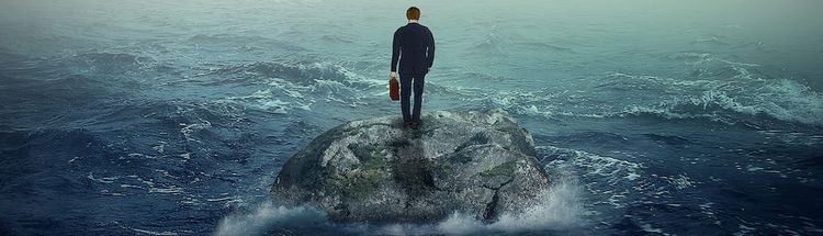 Failure crisis concept and lost business career education opportunity. Lonely young man on a rock cliff island surrounded by an ocean storm waves