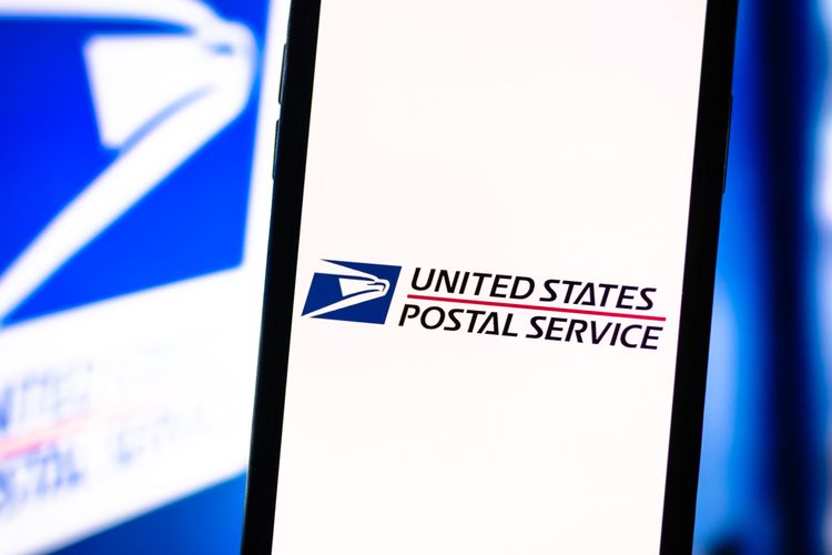 Smartphone with the USPS logo on the screen. United States Postal Service app.